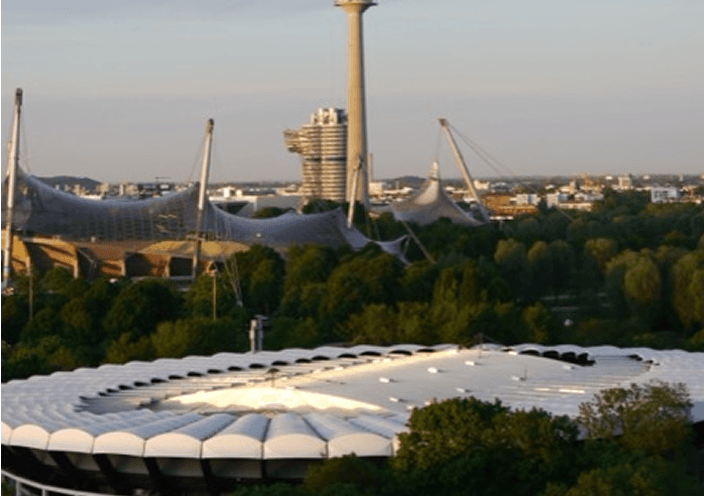 Munich's Olympiapark with the fan-fest stage in front of the Olympic tower and stadium roof.