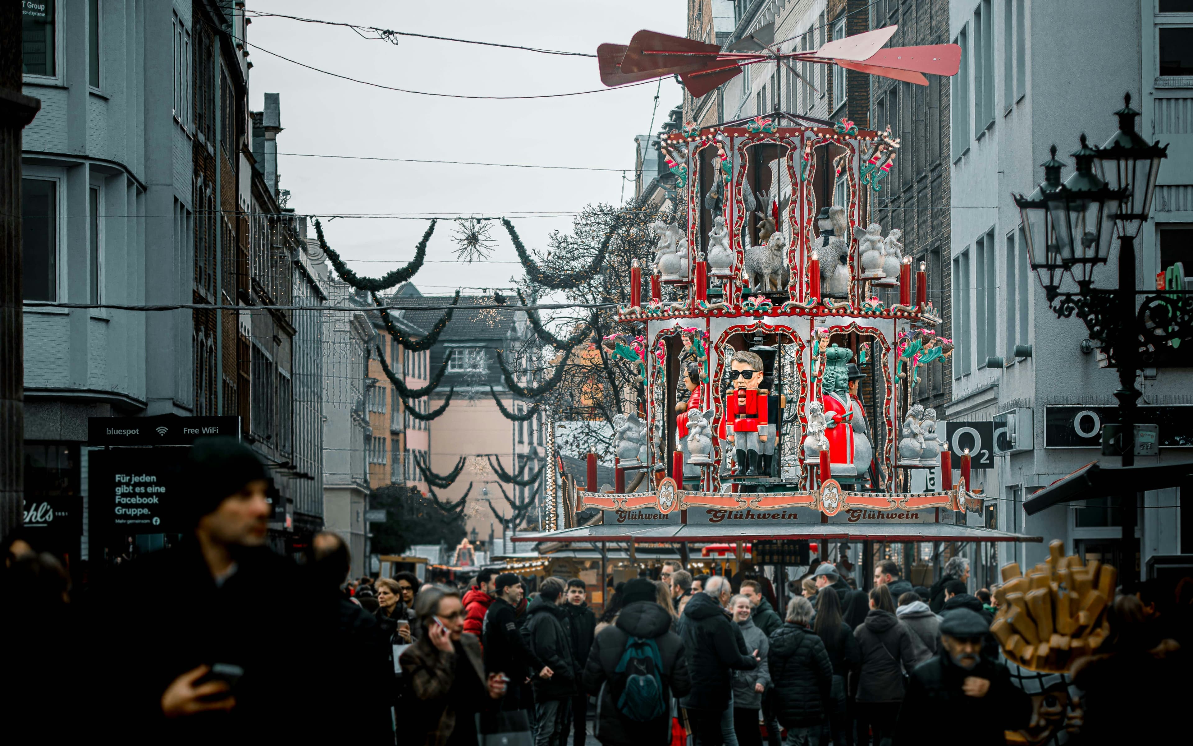 Festively decorated Düsseldorf city centre with an Asian carousel pagoda during Japan Day.