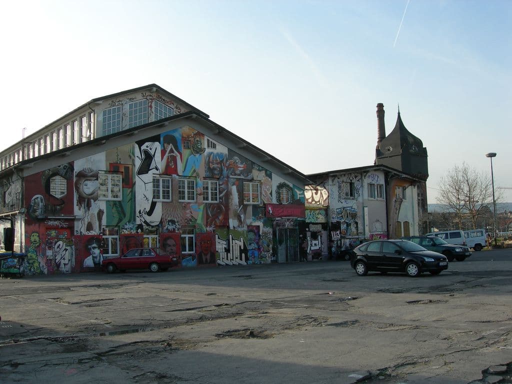 Exterior of the Schlachthof Wiesbaden cultural centre with graffiti-covered facade.